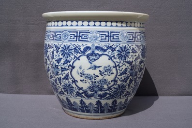 A Chinese blue and white fish bowl and a famille rose 'dragon' jardini&egrave;re, 19th C. and Yongzheng